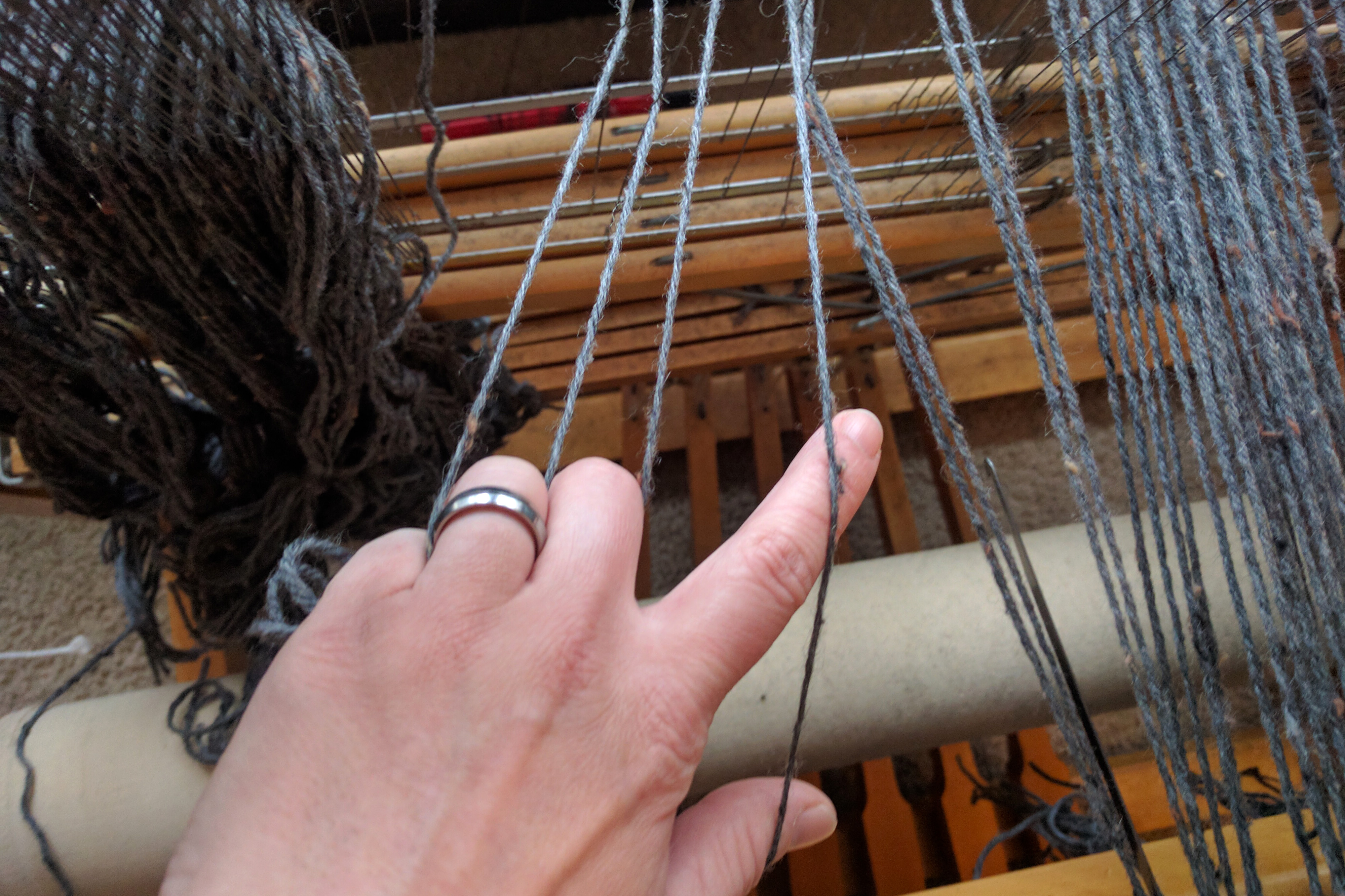 It's important to make sure the ends coming from the heddles go into the reed in the correct order.