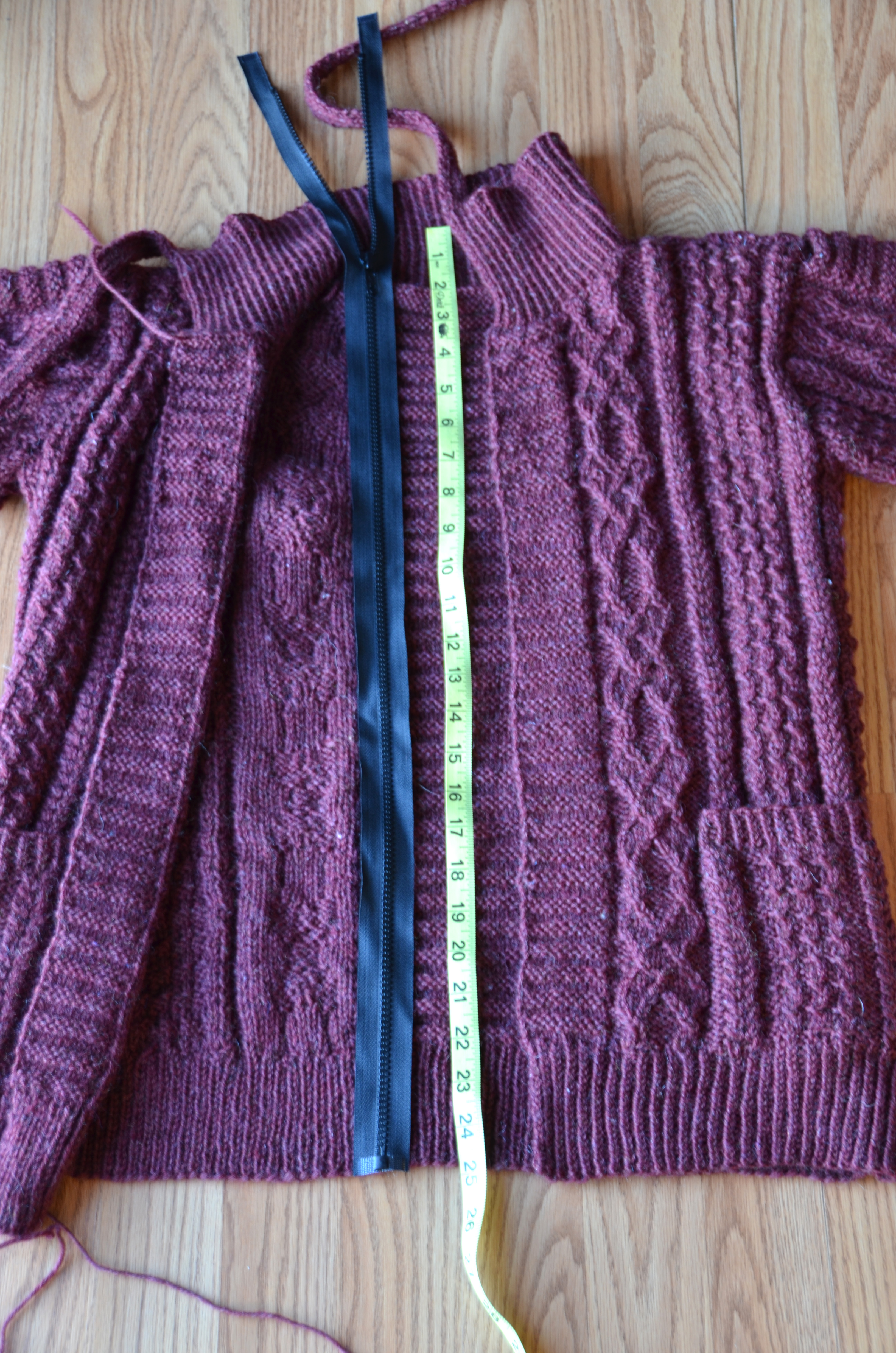 Be sure not to stretch the knitting when measuring for the zipper.