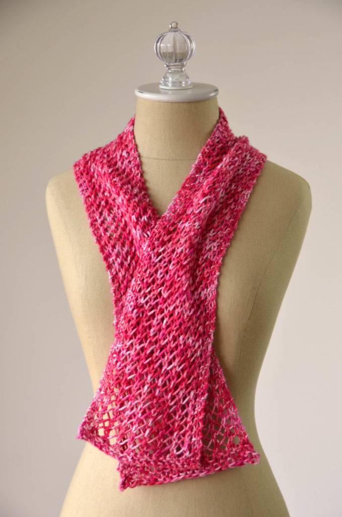 red lace cotton scarf on a tan dressform