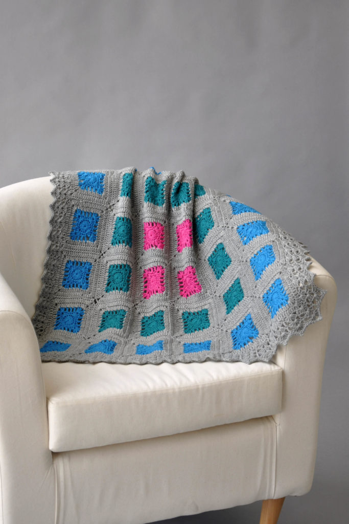 Oasis Blanket draped over chair