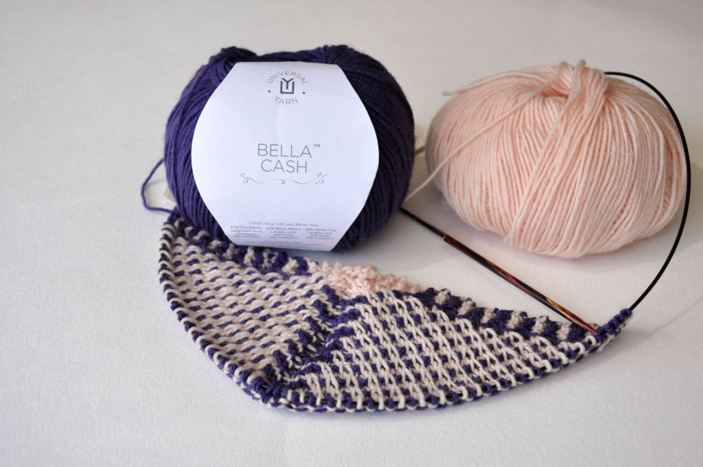 Peach and dark purple balls of Bella Cash yarn and knitted slip stitch swatch