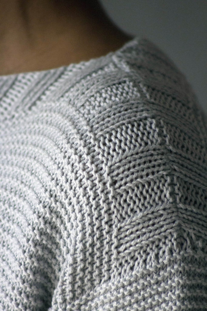 Closeup of seam at shoulder of knitted top
