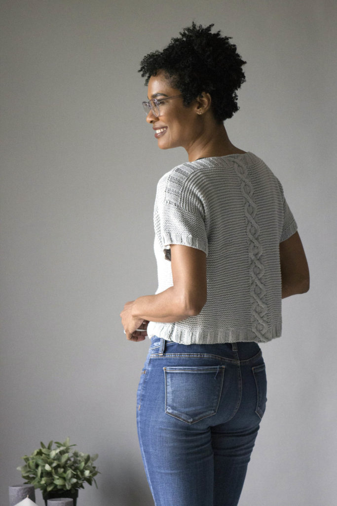 Rear view of woman in cabled Bamboo Pop tee