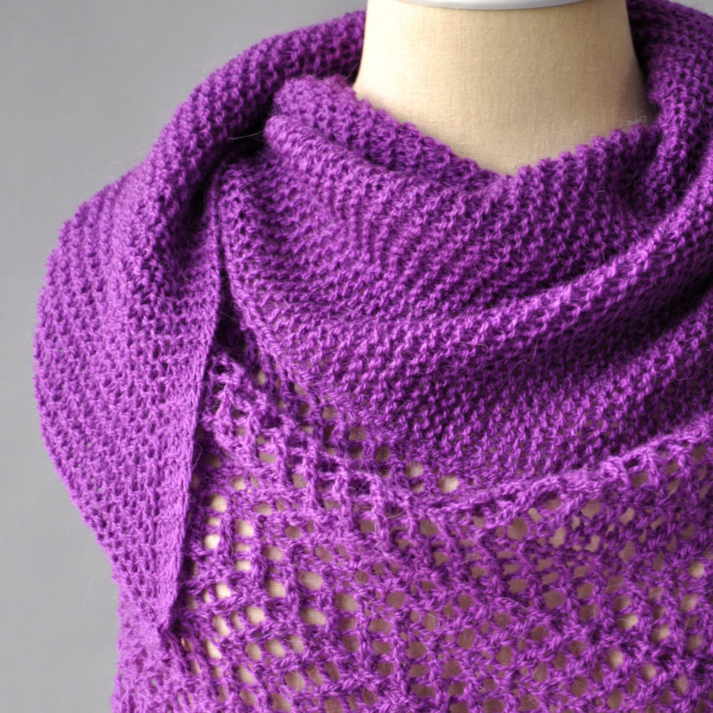 Detail closeup of purple shawl crafted in Universal Yarn Finn