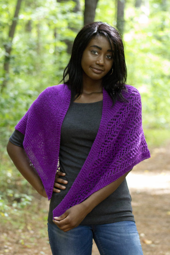 Woman outdoors wearing garter stitch and lace knit shawl