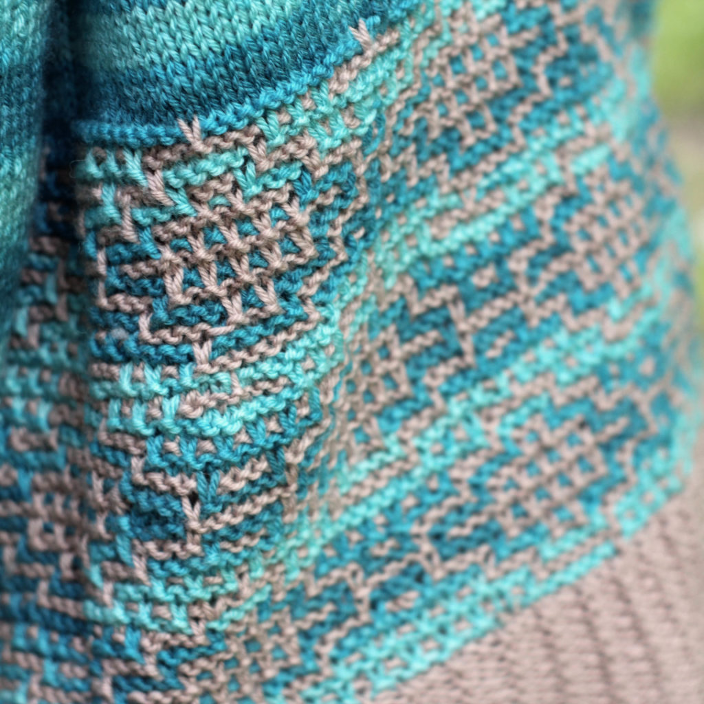 close up of mosaic-knit slip stitch pattern in Adore and Adore Colors yarns