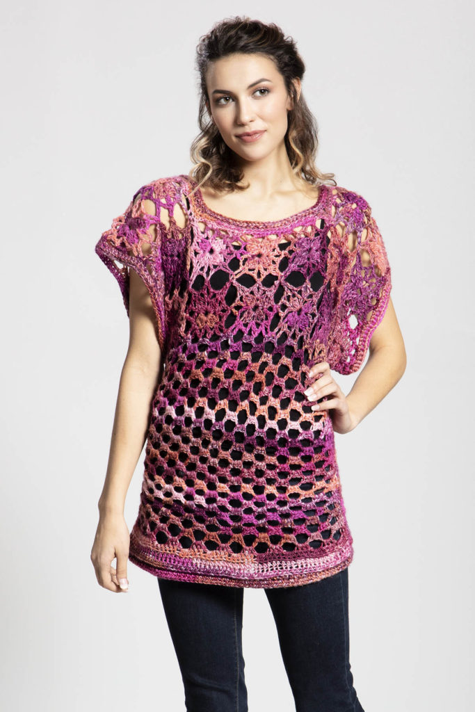woman wearing bright pink lace tunic crocheted in Classic Shades Frenzy