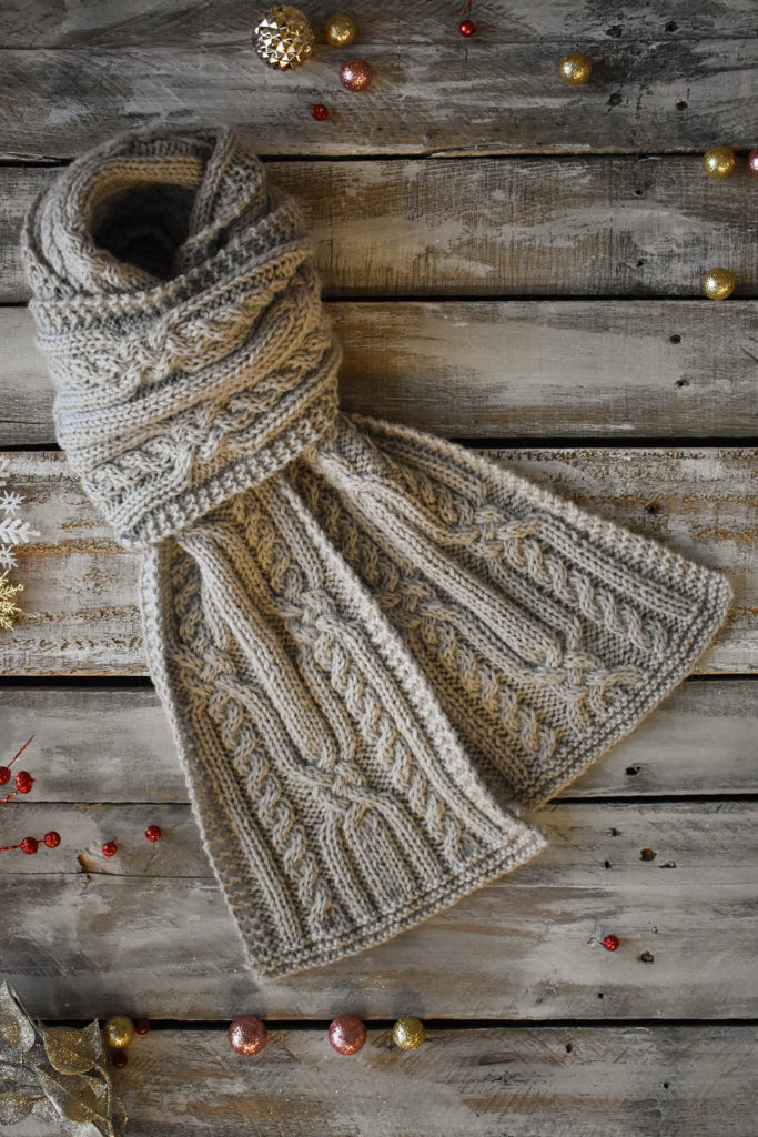 A cabled scarf knit in Universal Yarn Deluxe Worsted