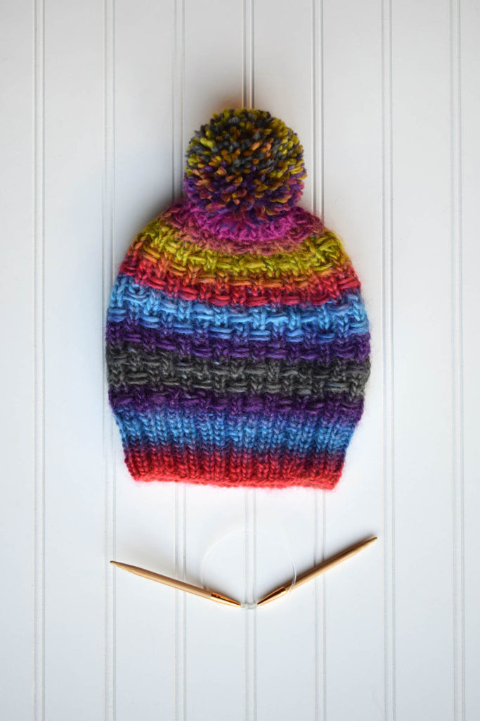 Image of colorful striped hat knit in Classic Shades yarn