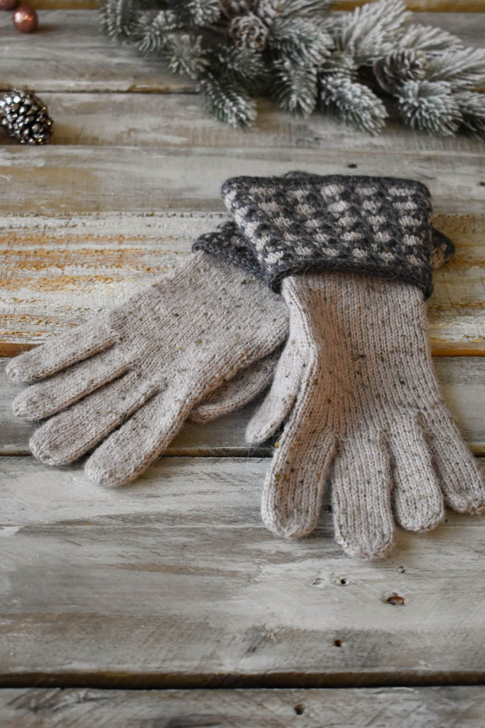 Hand-knit gauntlet style gloves featuring colorwork and cables