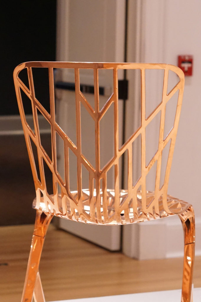 Image of a gold chair from a museum.