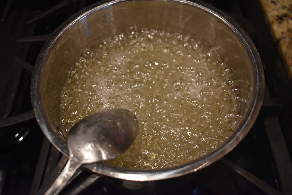 Water, corn syrup, salt, and water boiling.