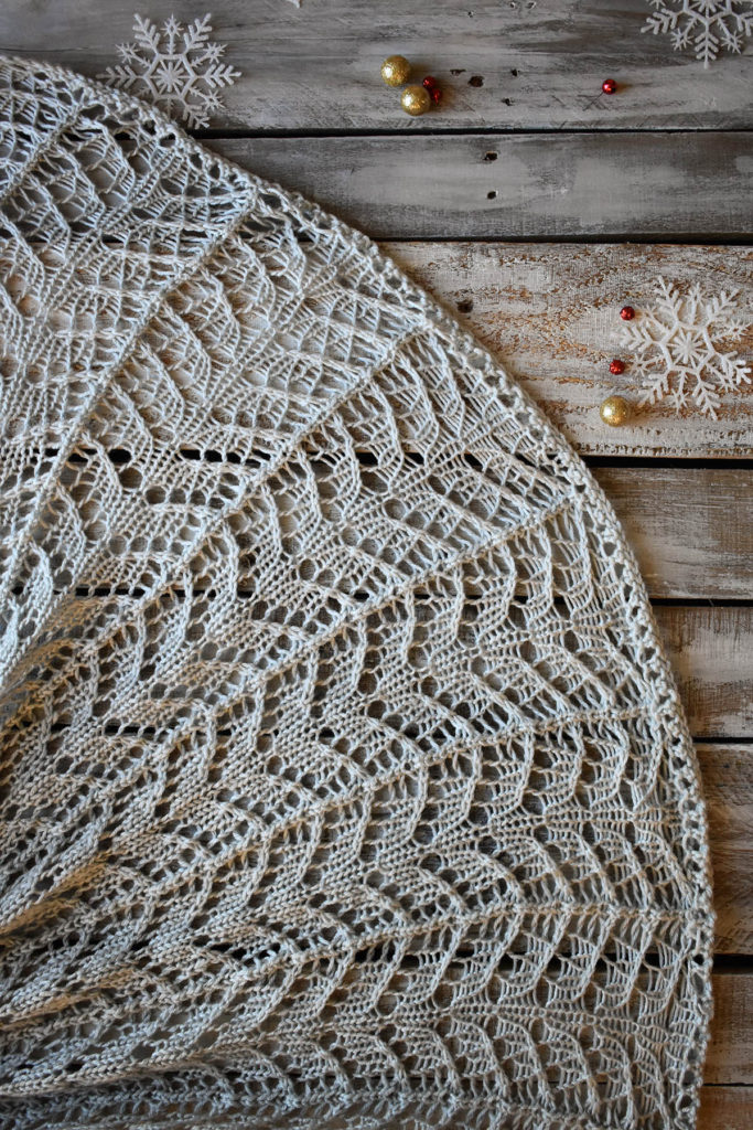 Detail of a lace blanket knit using Universal Yarn Uptown Worsted.