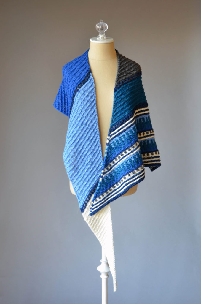 A hand-knit shawl in shades of blue