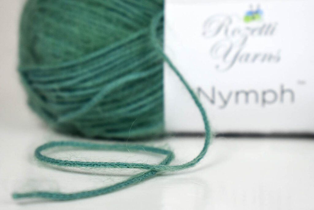 Image of green ball of Nymph yarn showing texture