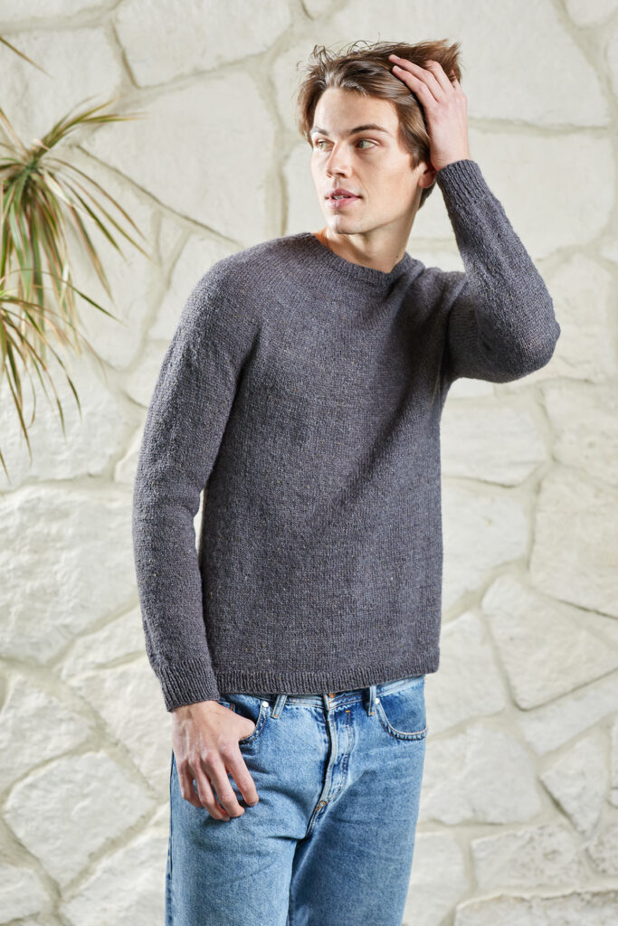 Young man wearing gray Damascus sweater knit in Kingston Tweed