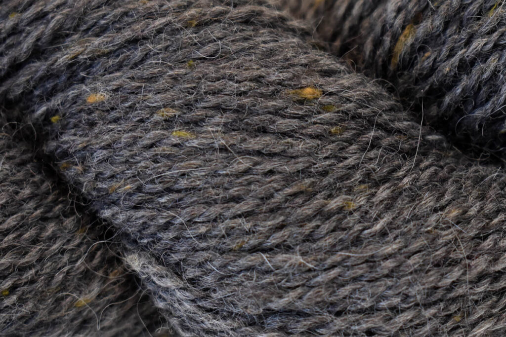 Closeup of Kingston Tweed yarn hank in color Basalt 112
