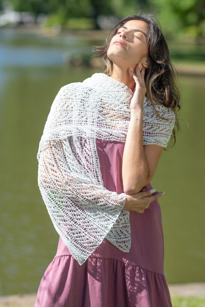 Woman outdoors wearing silvery lace wrap knitted in Flax yarn