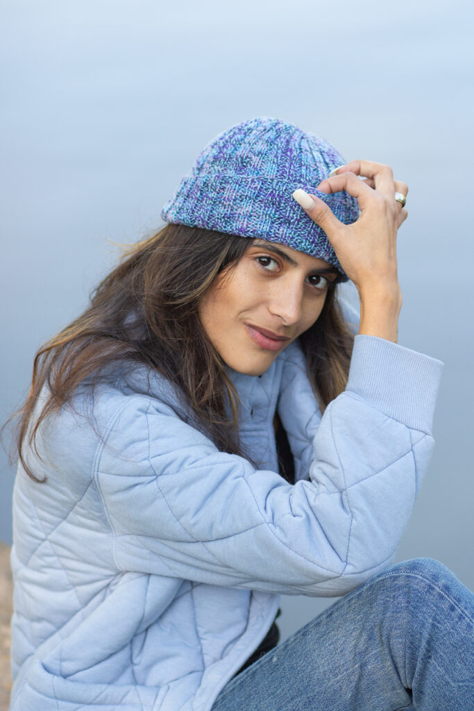 Woman wearing blue knitted hat