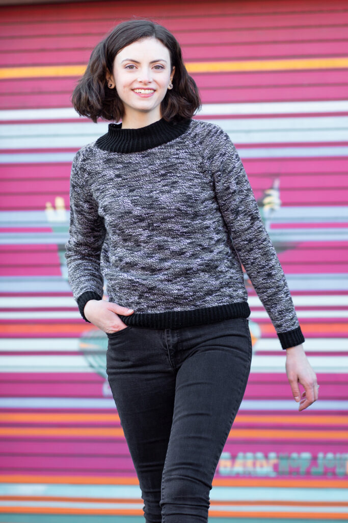 Woman wearing black and white knitted sweater