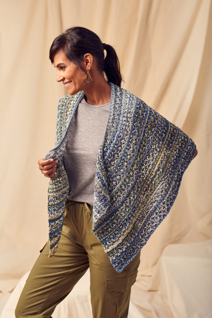 Woman wearing semi-circular knitted lace shawl