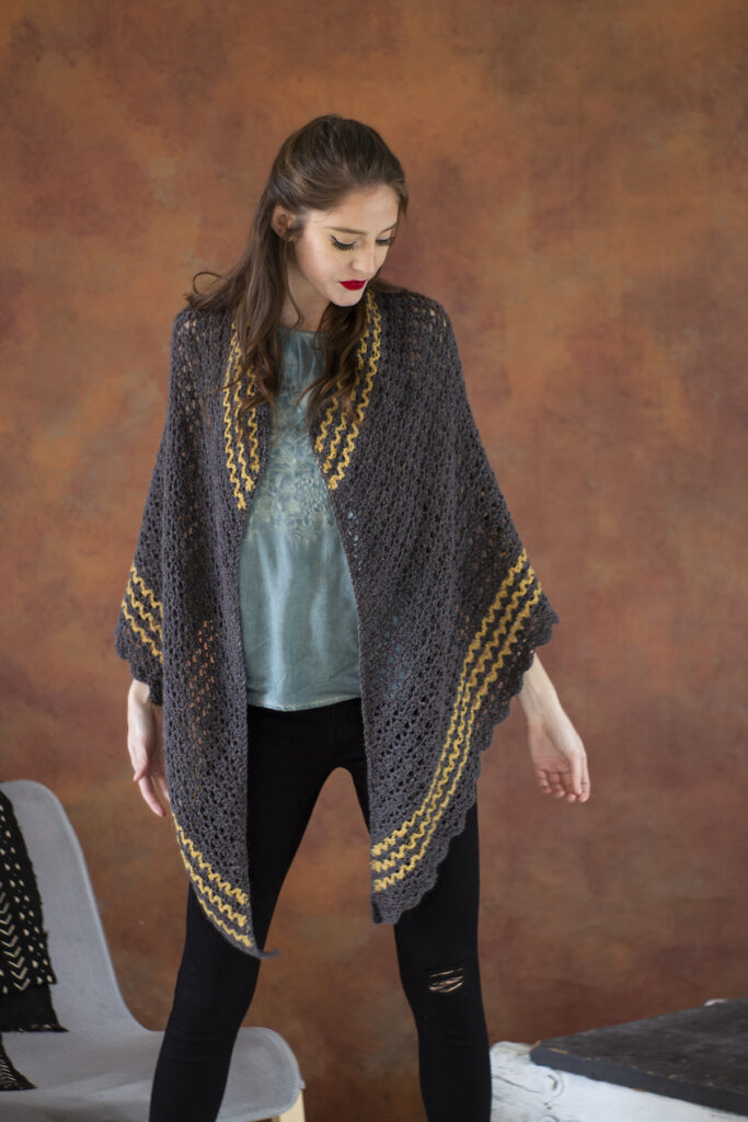 Woman wearing Branscombe shawl crocheted in Kingston Tweed