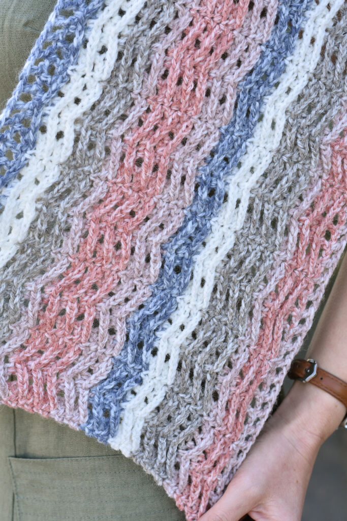 Close up photo of the Foxglove wrap, showing of the Herrington Lace Pattern.