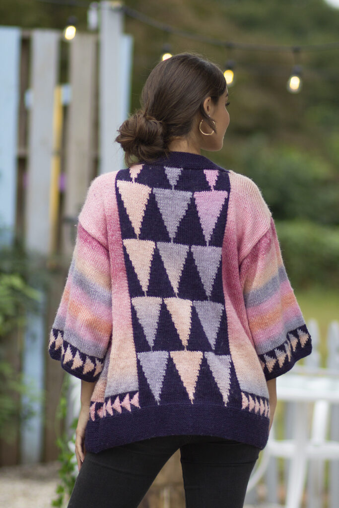 The back of the Slant cardigan as it is being worn by a person