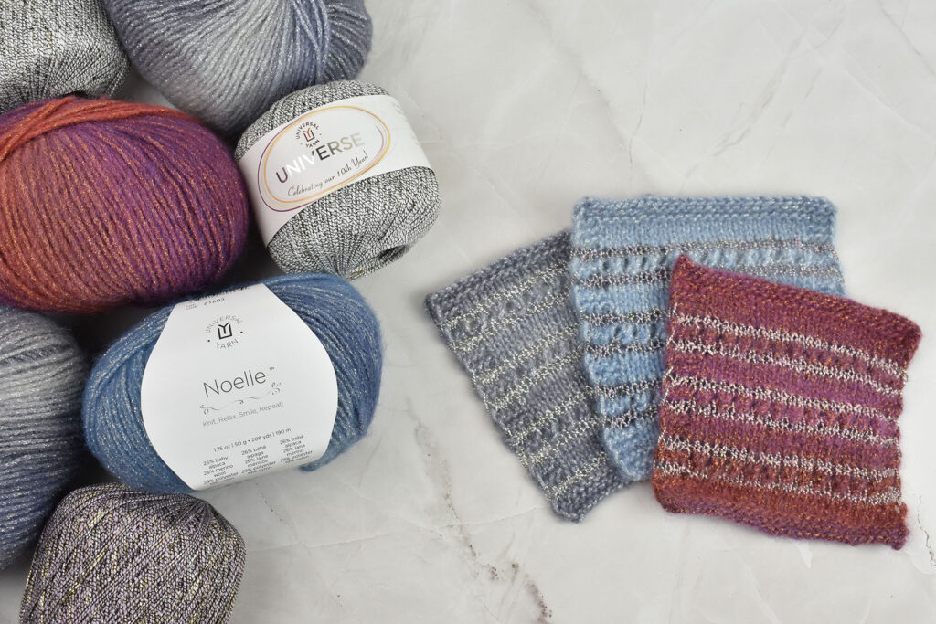 Photo of skeins of Noelle and Universe to the left with knitted swatches of the two in the middle of the picture